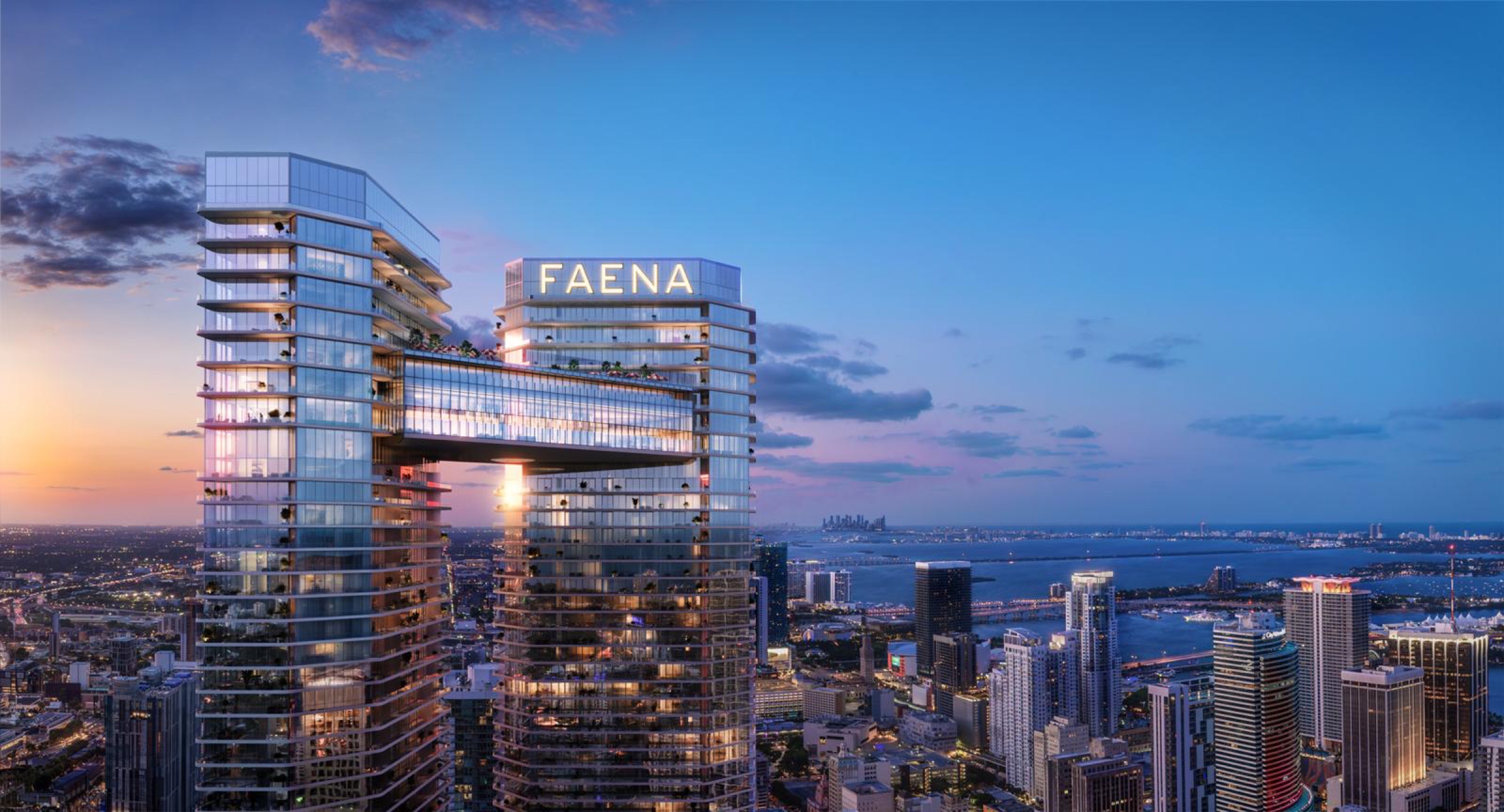 Rendering of Faena Residences Miami above the Miami River with the bay beyond