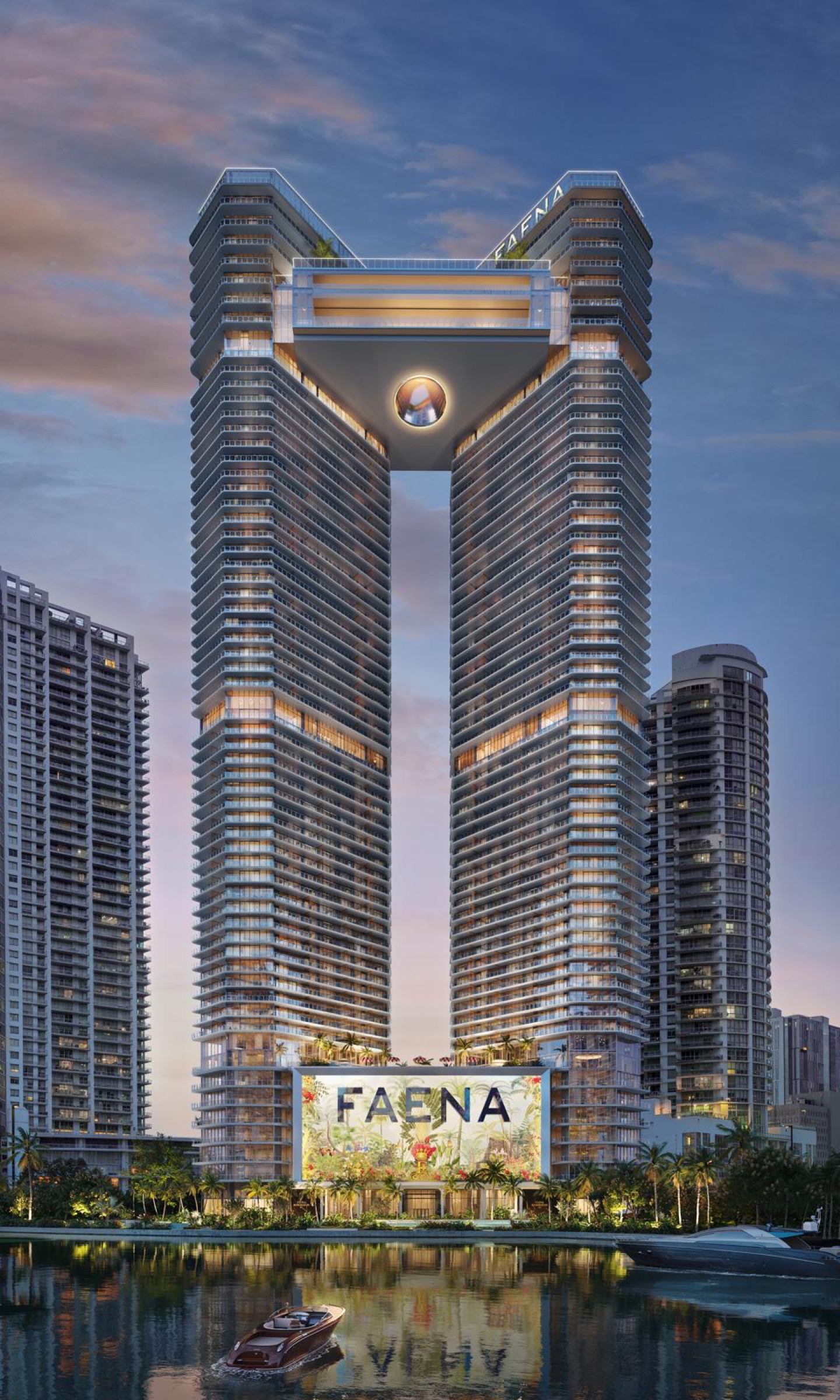 The towers at dusk with the FAENA mural lit above the river